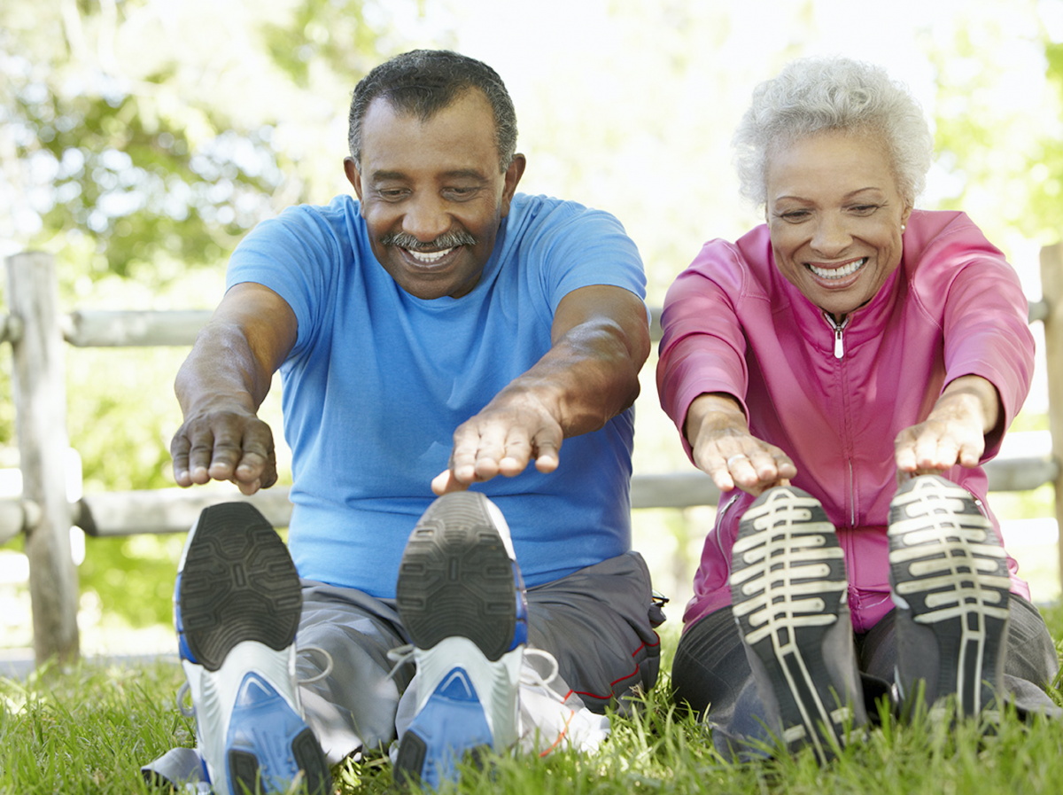 two older people stretching